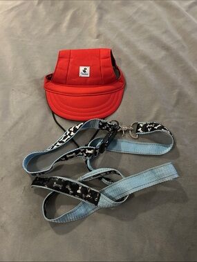 Red Dog Sun Visor Hat with Light Blue Leash.